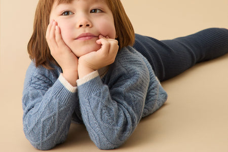 Beautiful girl wearing MORI's Yellow Cable Knit Jumper & Knitted Colourblock Beanie Hat