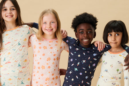 Baby boy and girl wearing MORI's Ribbed Pyjamas - blue & pink